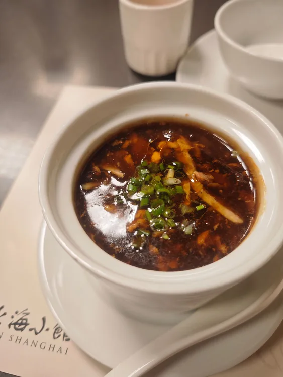 Hot & sour chicken soup served at Indian Bell