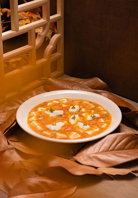 Hot & sour vegetable soup served at Indian Bell