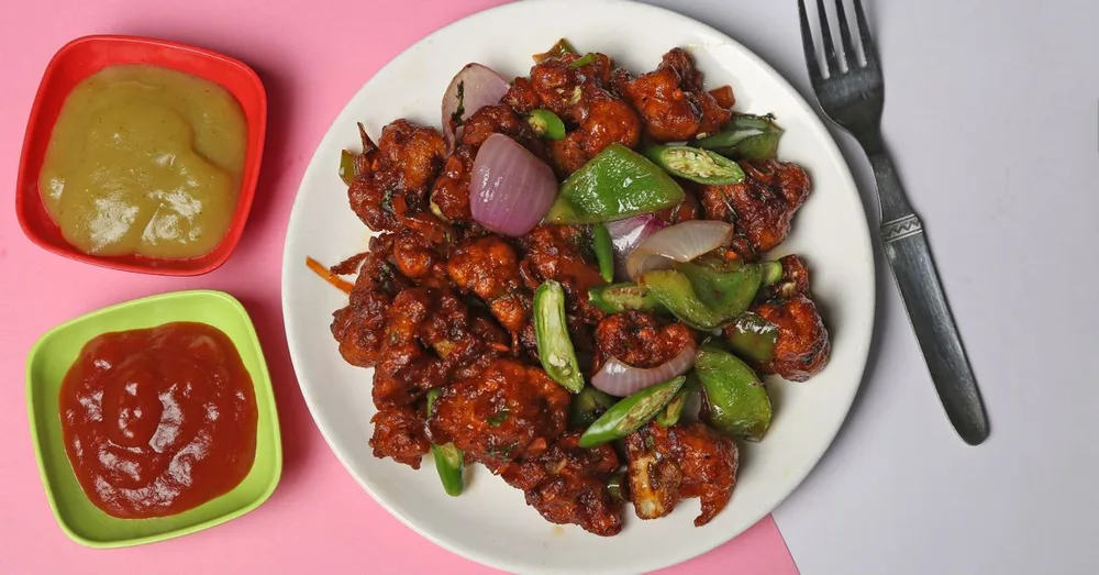 Schezwan gobi vegetable served at Indian Bell